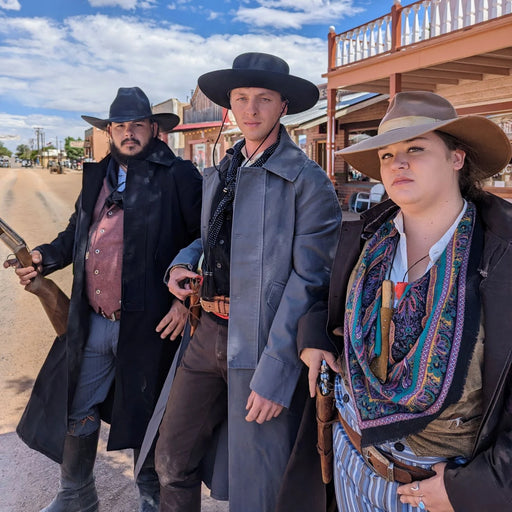old west cosplayers dressed in western dusters on the street in Tombstone