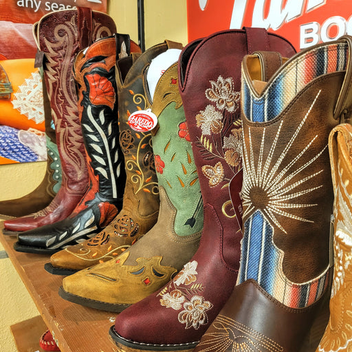 A row of women's western leather boots.