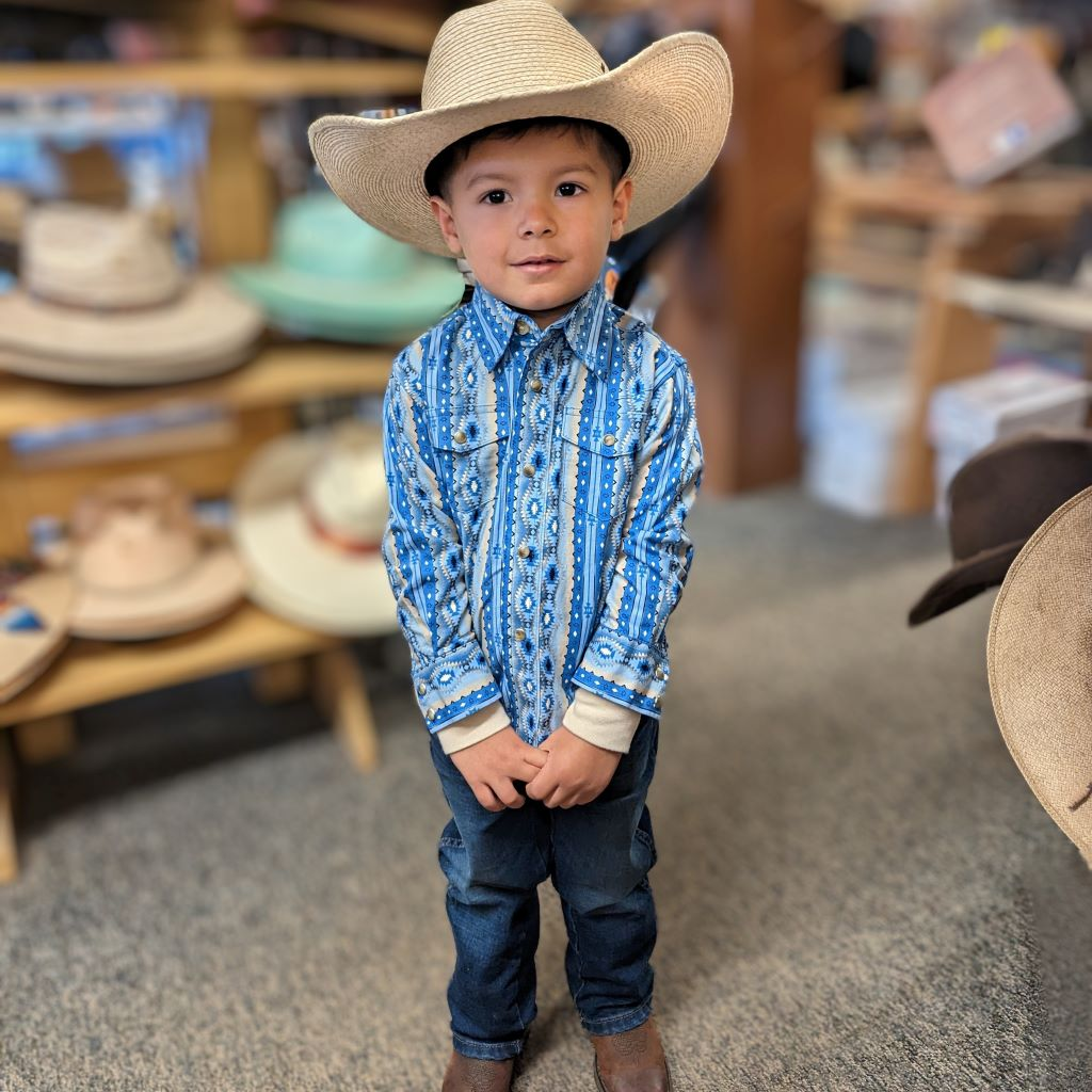 small boy in western wear and a western hat