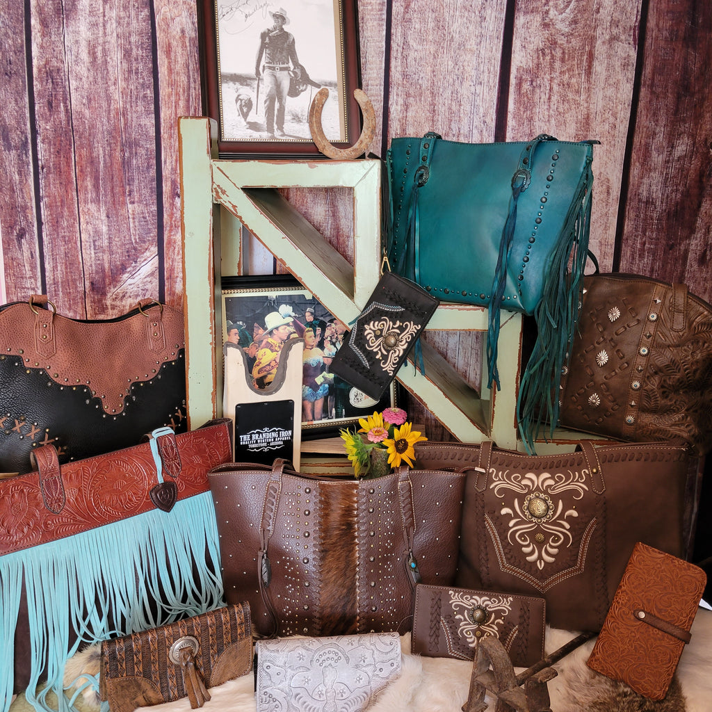 a selection of purses and wallets of various styles
