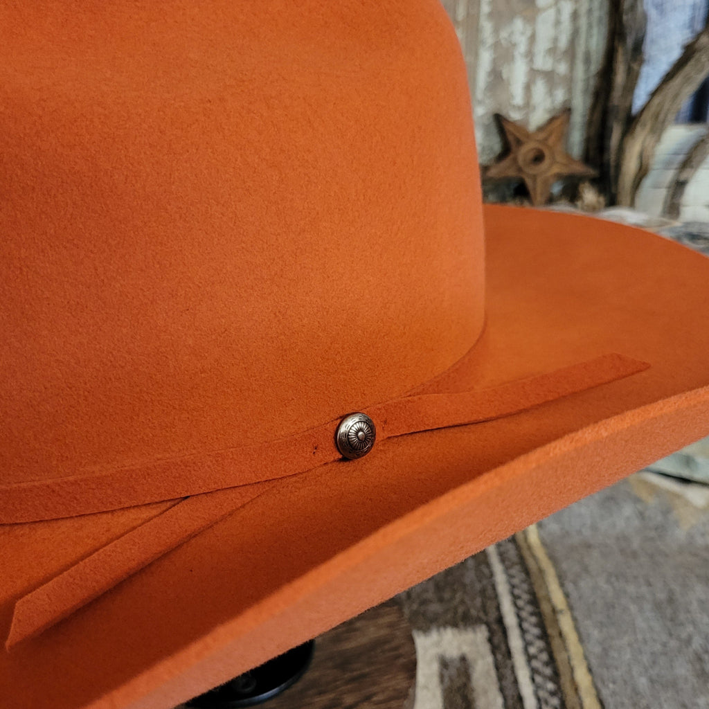 Close up showcases the thin band with mini concho.