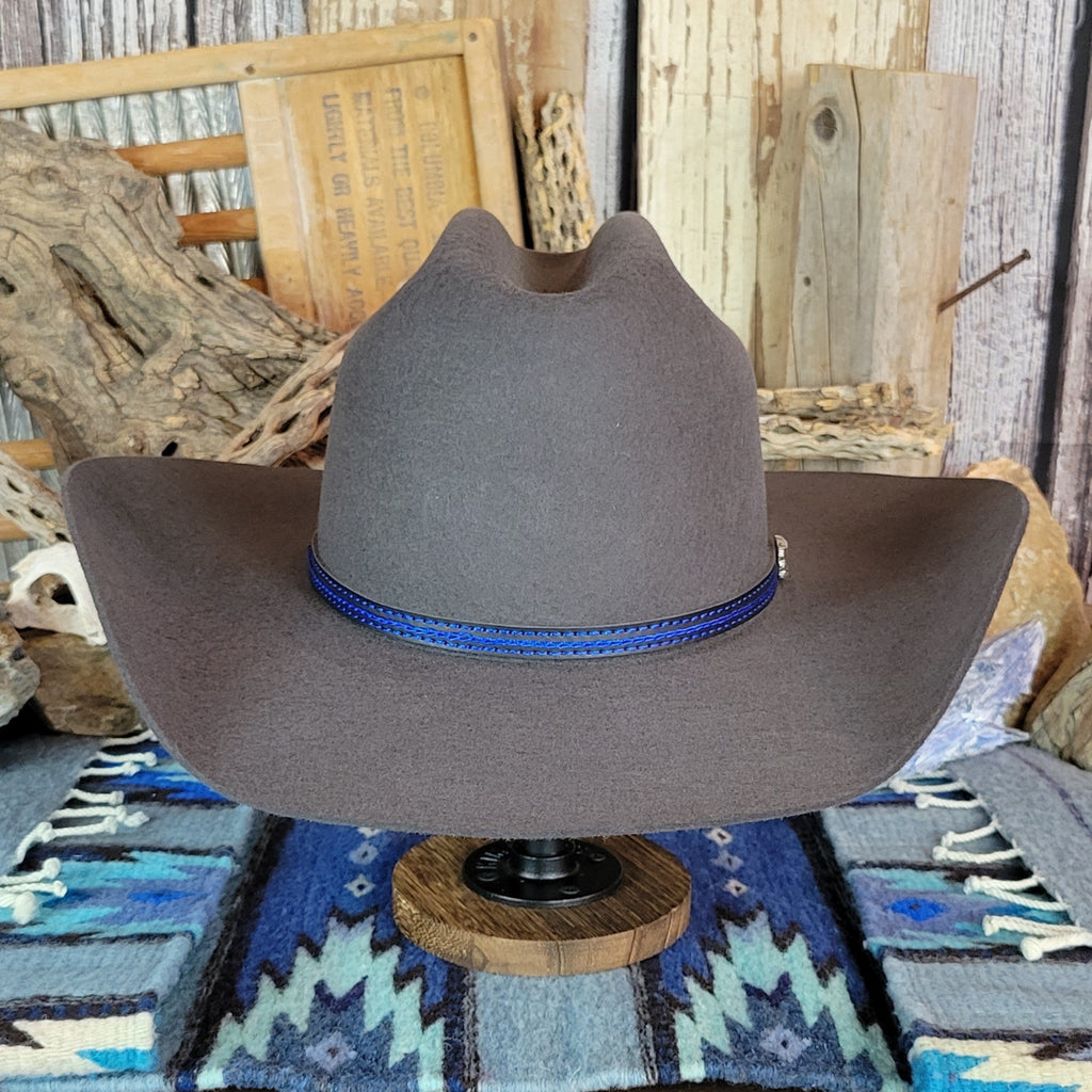Gray wool felt hat with a blue band and silver accent.