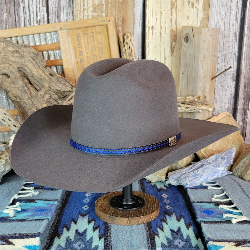 Gray wool felt hat with a blue band and silver accent.