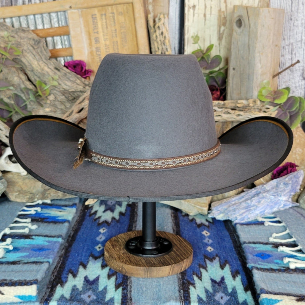 A gray wool felt hat with a detailed band.