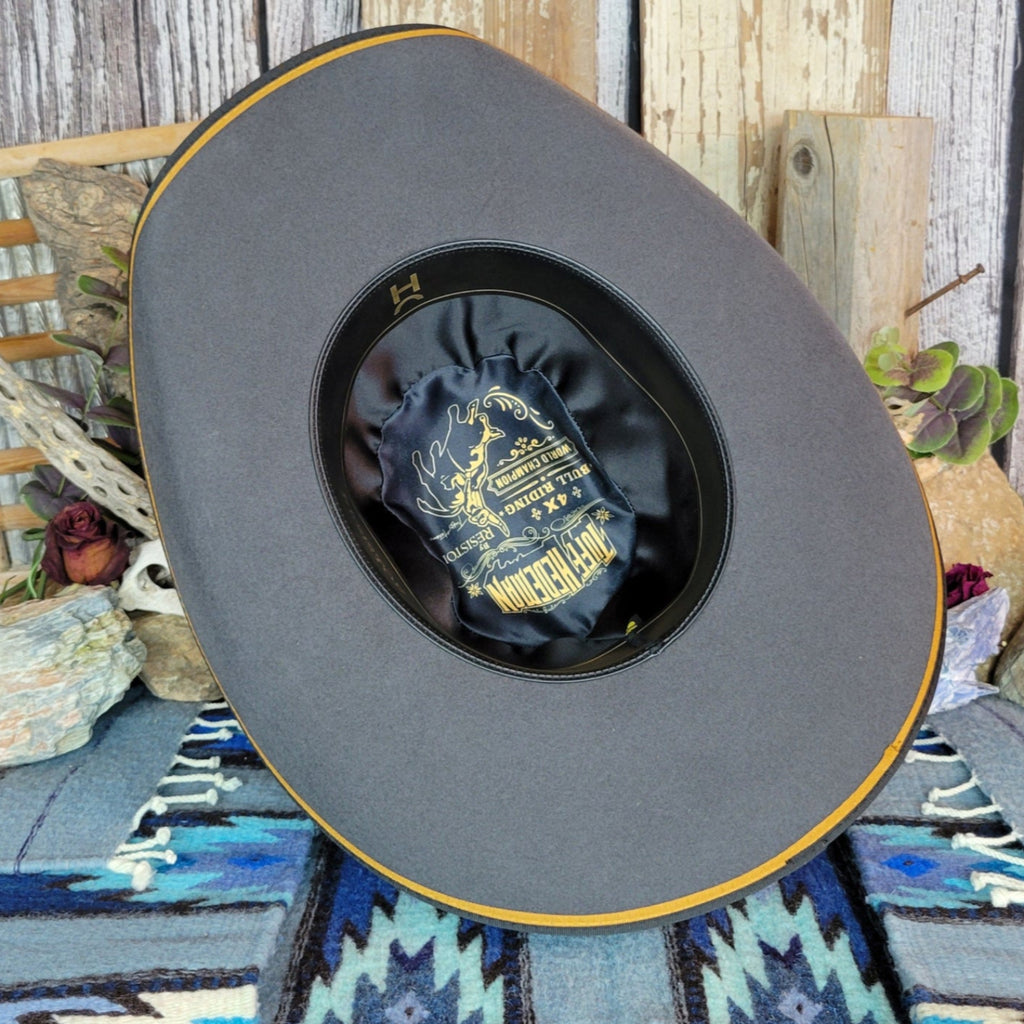 The interior of the hat has a sweatband and is satin lined.
