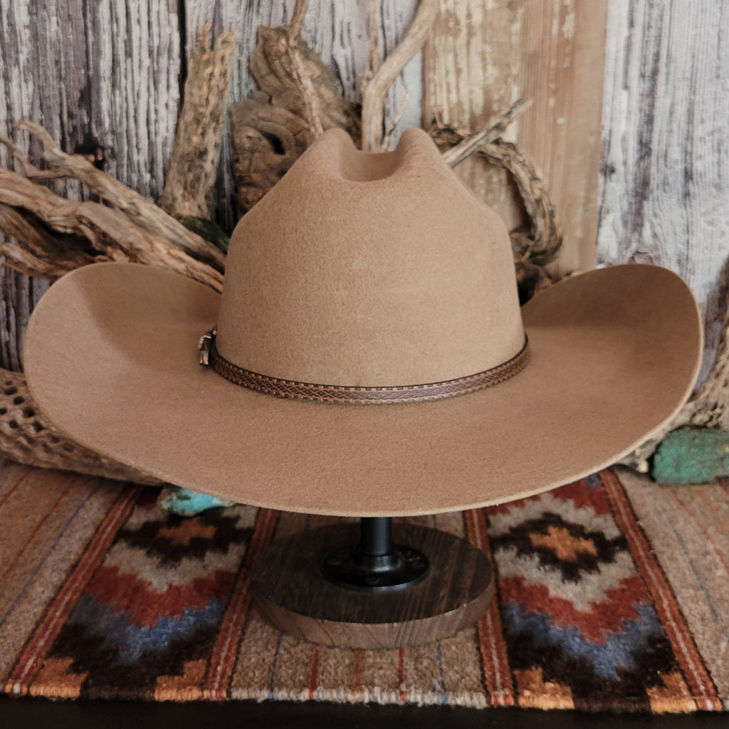 Tan wool hat with a brown leather band.