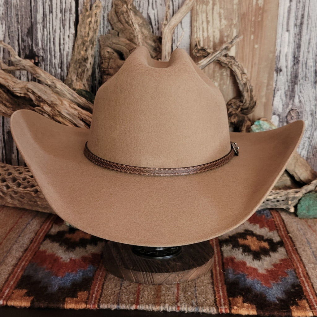 Tan wool hat with a brown leather band.