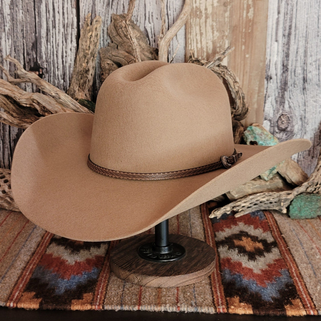 Tan wool hat with a brown leather band.