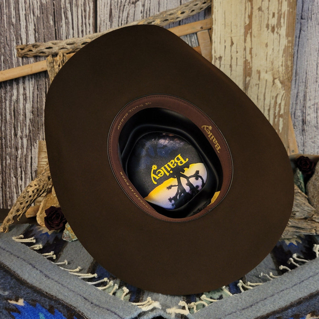 The interior of the hat showcases a decorative logo inside.