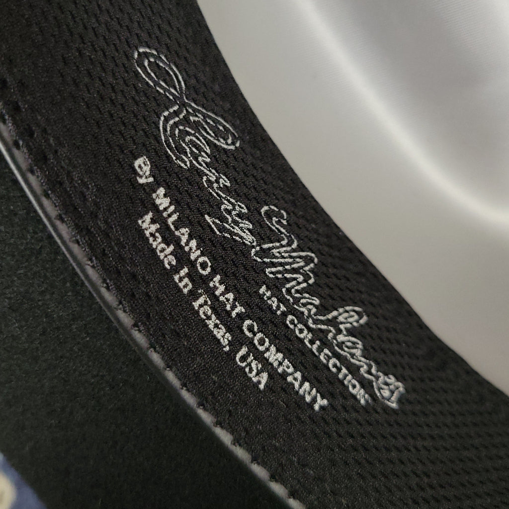 Close-up of a label on the sweatband with text and branding details.