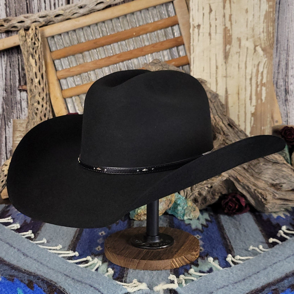 Black cowboy hat featuring a black leather band with silver detailing.