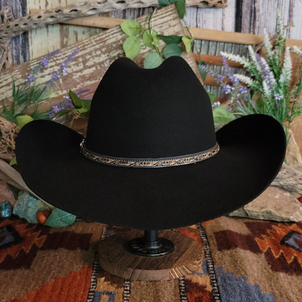 Black, wool cowboy hat with decorative leather hat band.