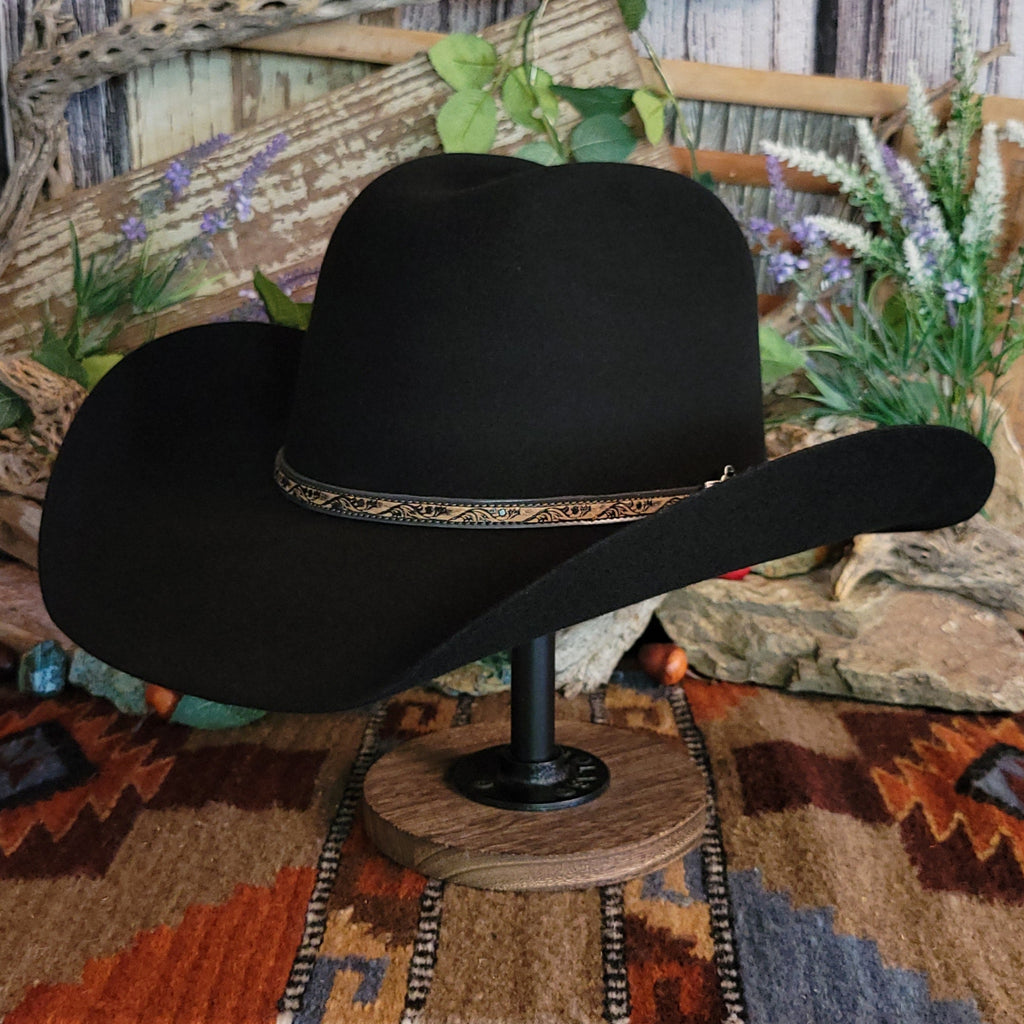Black, wool cowboy hat with decorative leather hat band.