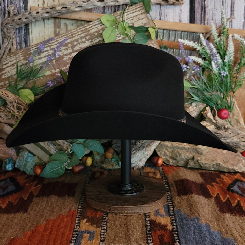 Black, wool cowboy hat with decorative leather hat band.