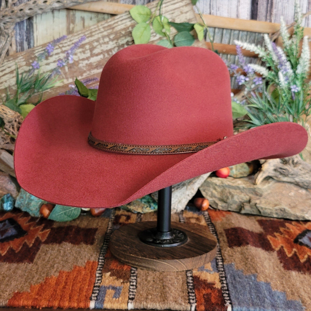 Carmine, wool cowboy hat with decorative leather hat band.