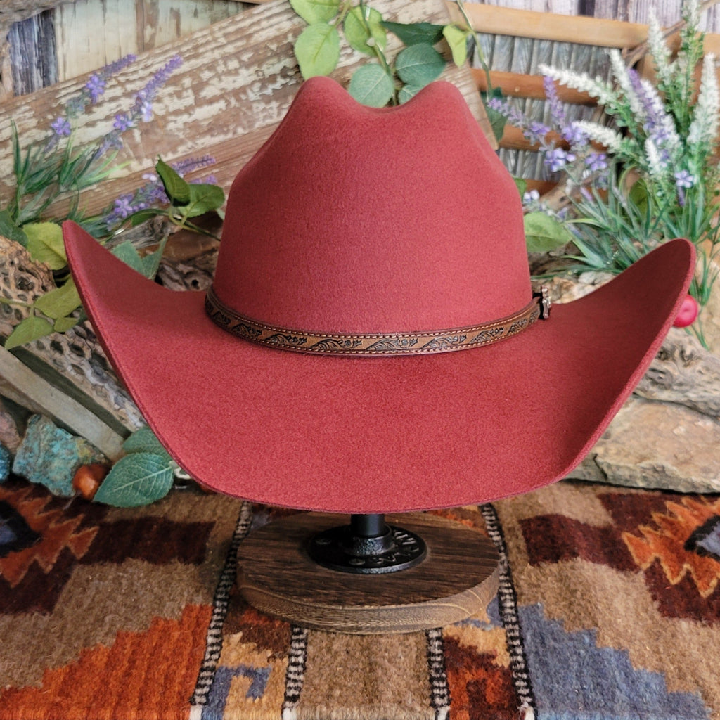 Carmine, wool cowboy hat with decorative leather hat band.