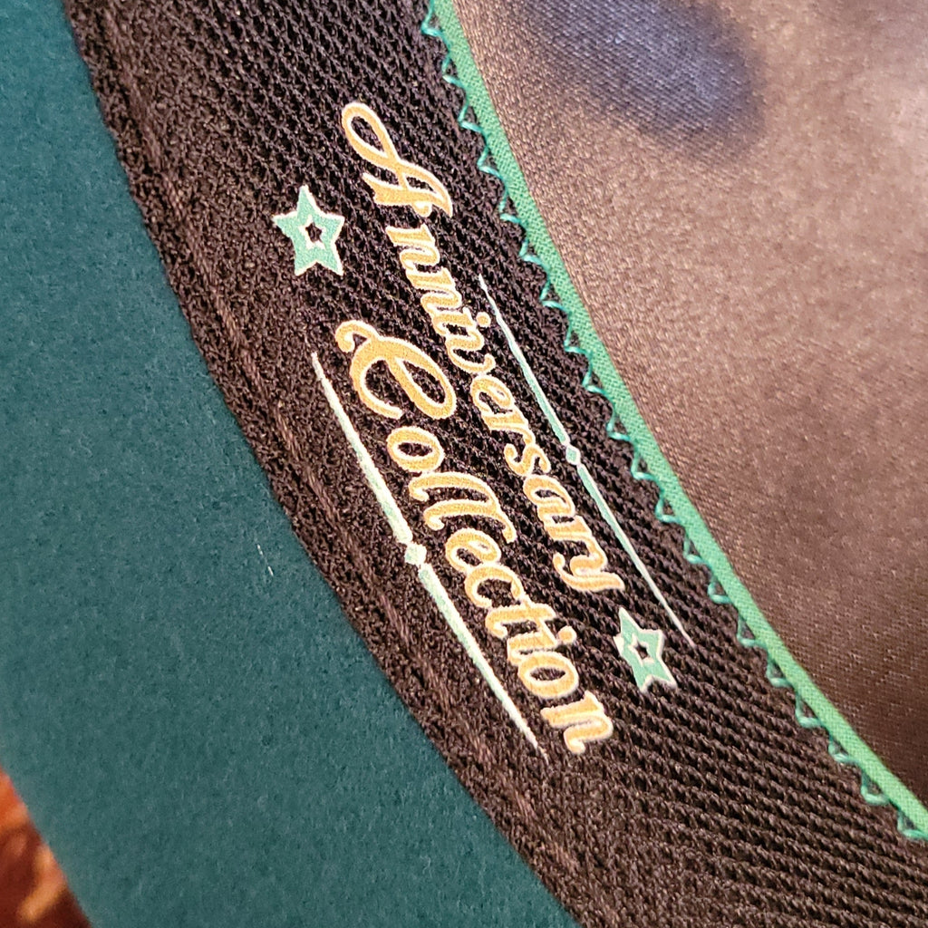 The interior of the hat showcases the "Anniversary Collection" lettering.