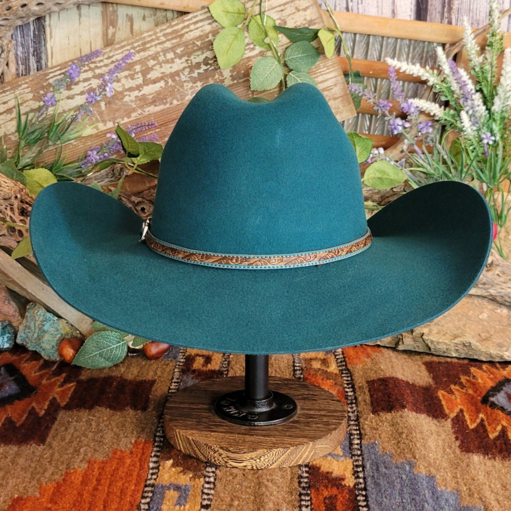 Turquoise, wool cowboy hat with decorative leather hat band.