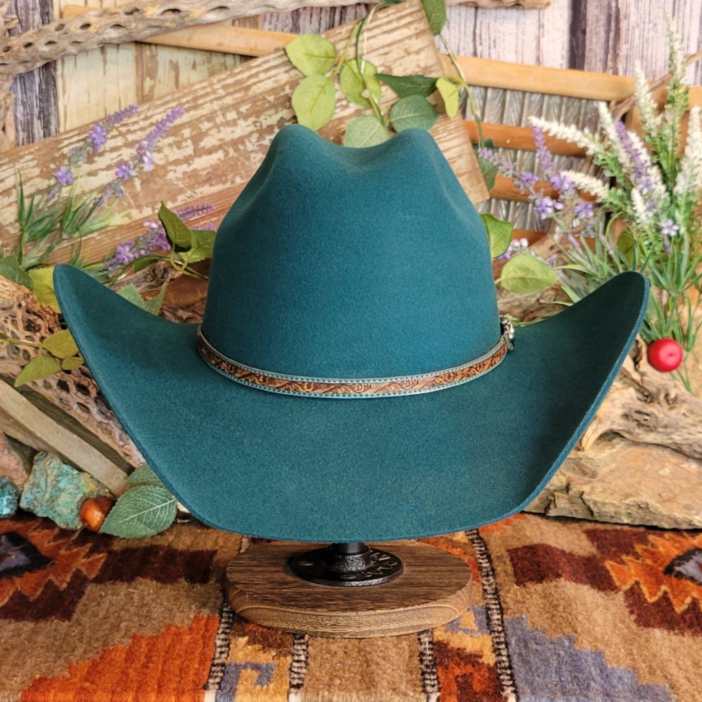 Turquoise, wool cowboy hat with decorative leather hat band.