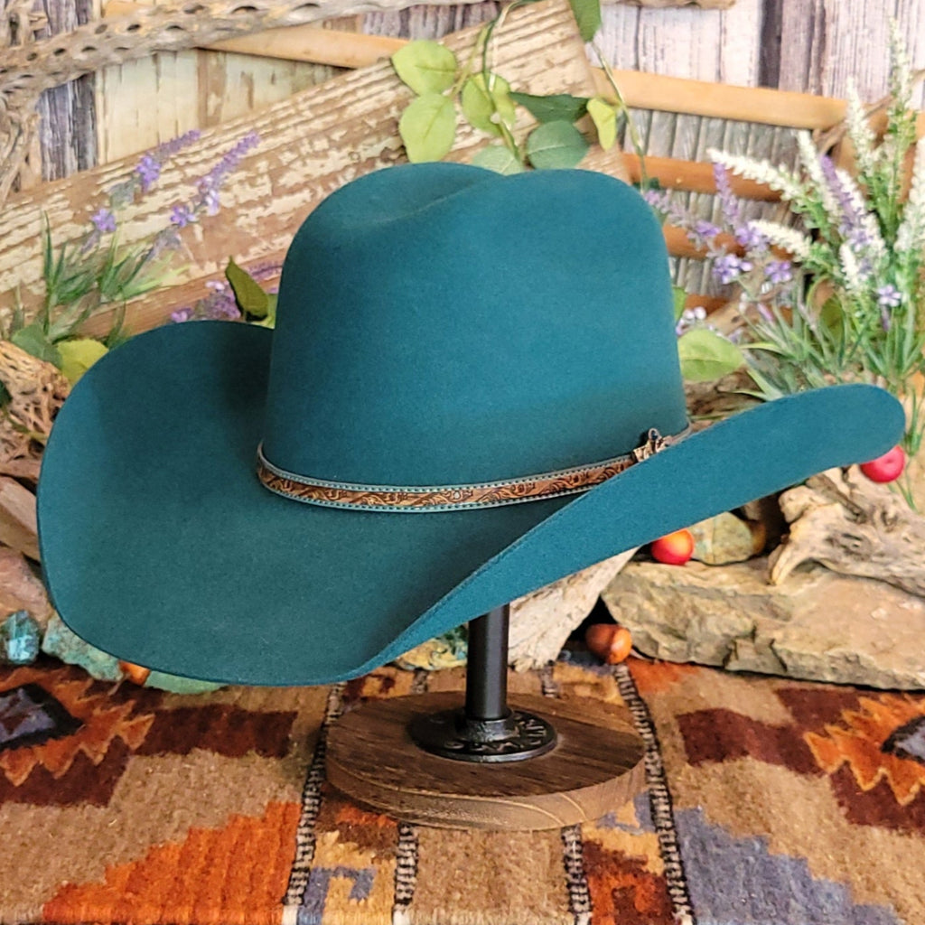 Turquoise, wool cowboy hat with decorative leather hat band.