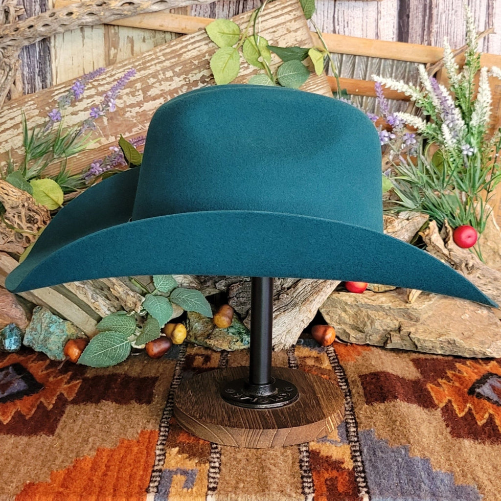Turquoise, wool cowboy hat with decorative leather hat band.