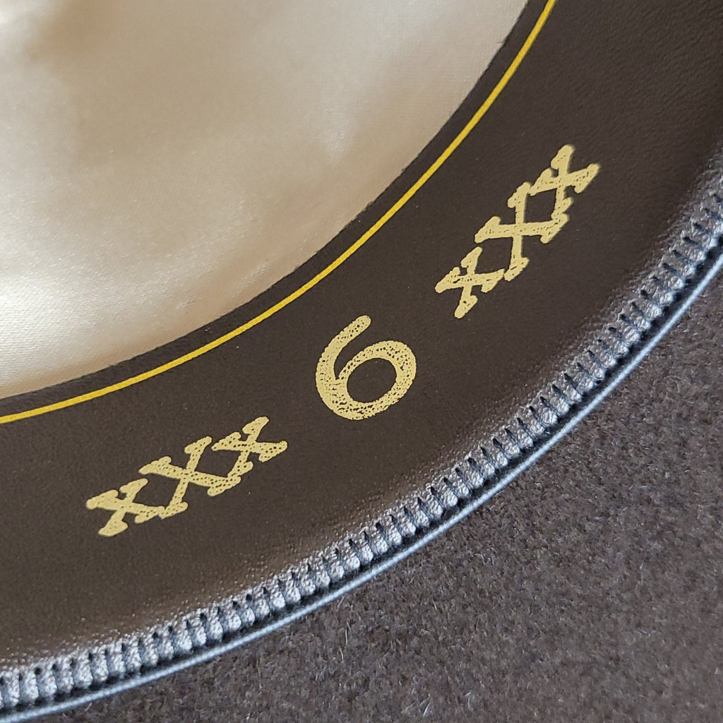 The authenticating 6X lettering on the sweatband in gold lettering.