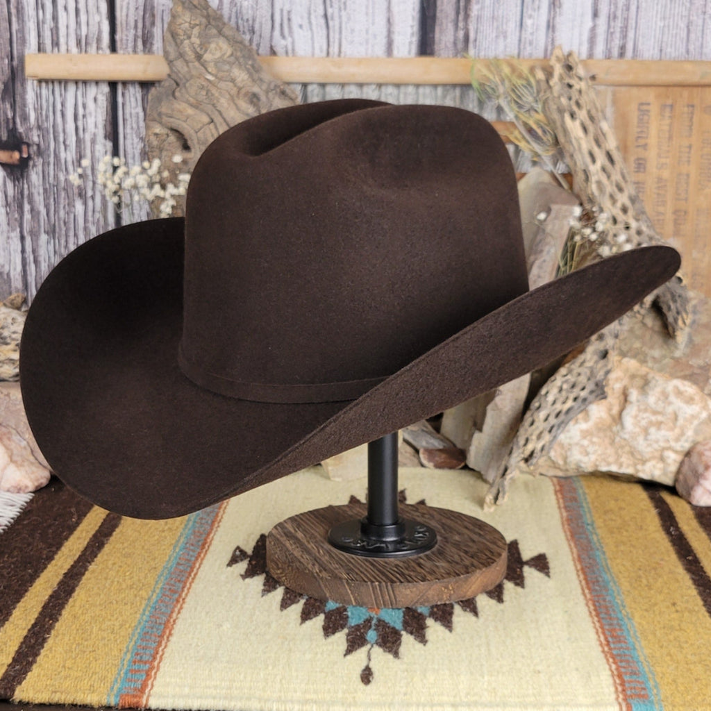 Black fur felt hat with black and mini belt buckle detail on the hat band.