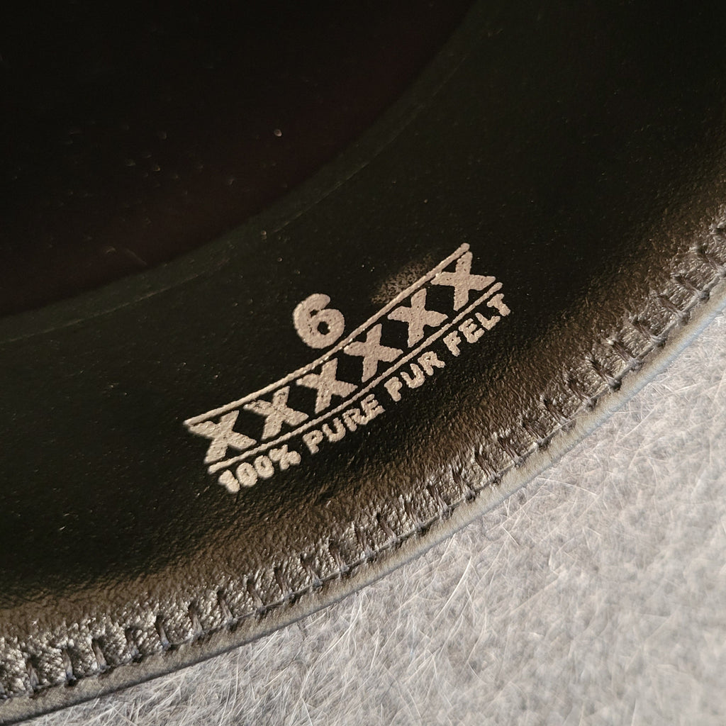Information about the fur felt hat is found on the interior band.