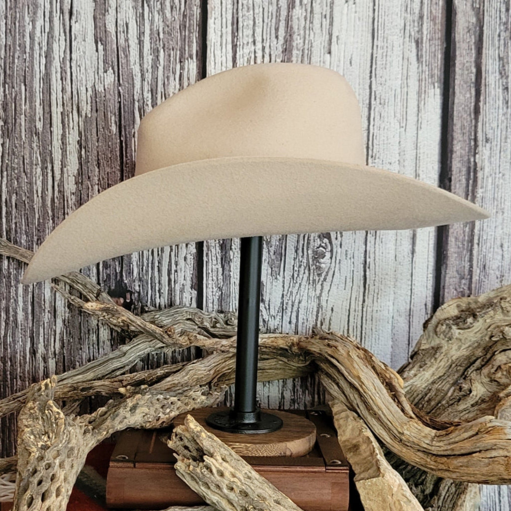 Cowboy hat in the color buckskin with a felt twine wrapped around the crown as a hat band.