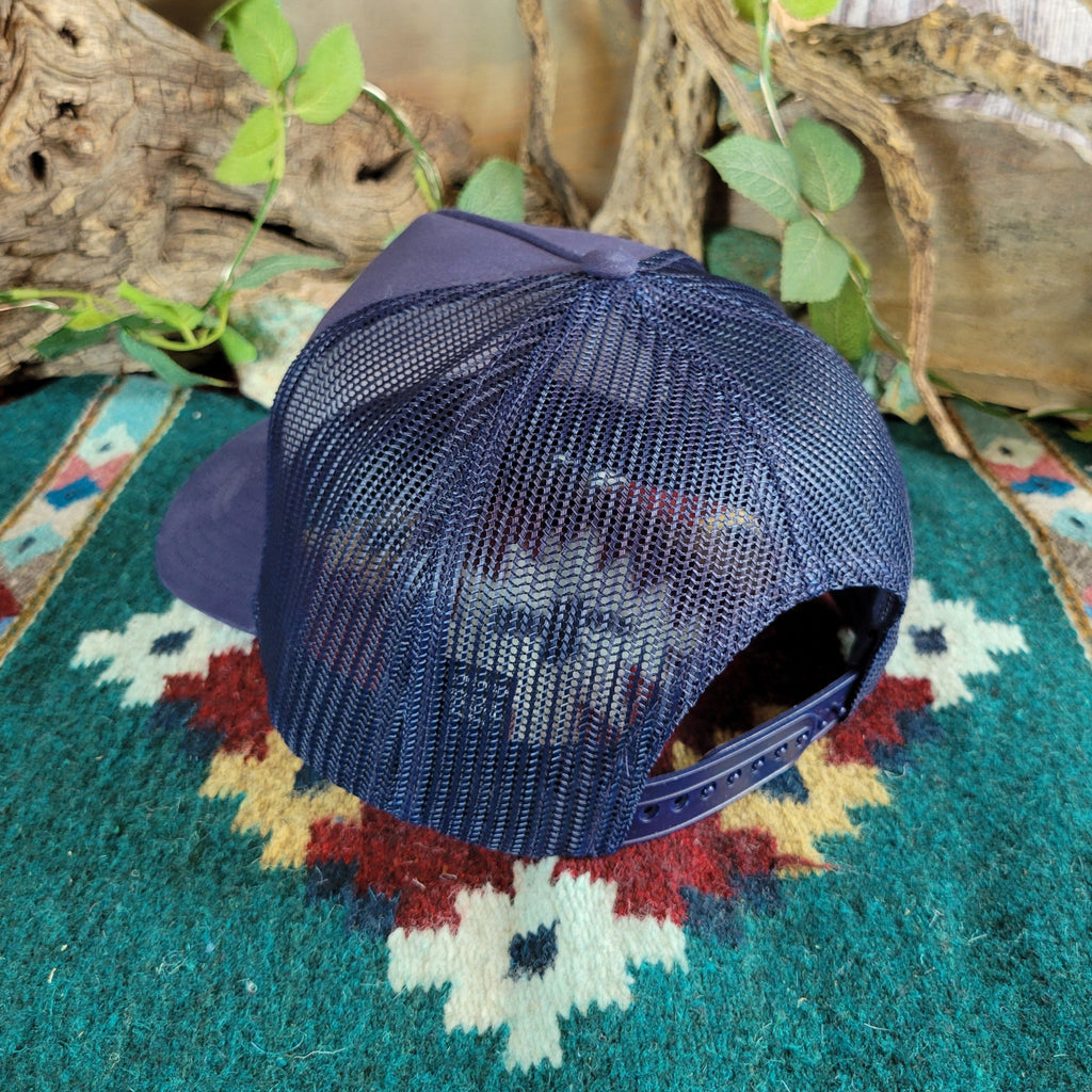 The back features the adjustable snap-back closure and mesh paneling.