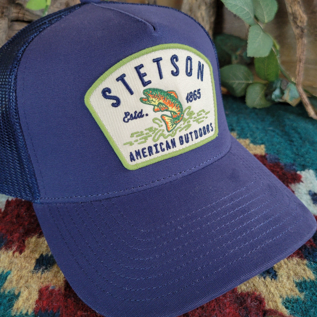 A close-up of the Stetson logo with a bass fish on the front.