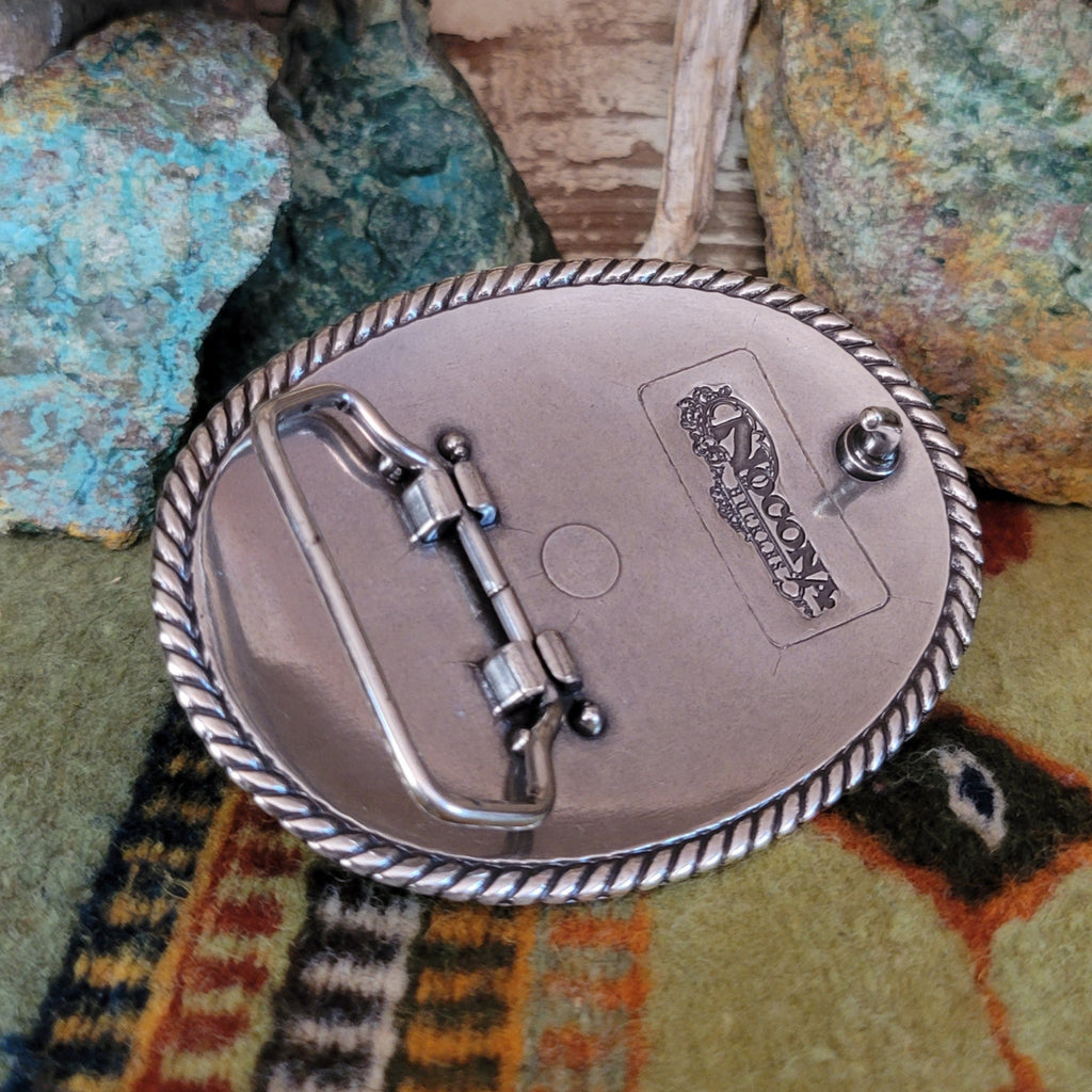 Silver-plated belt buckle with maker's stamp on the back.