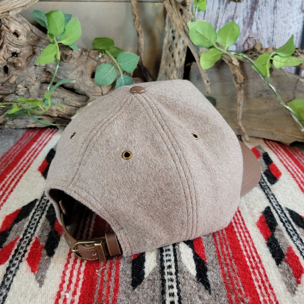 The back showcases an adjustable belt like closure.
