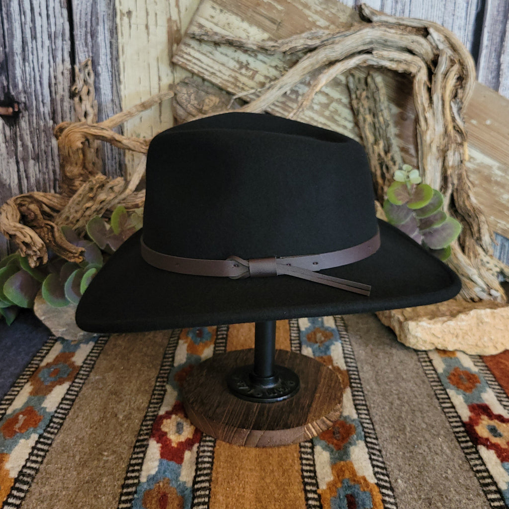 Black hat with a brown leather band.
