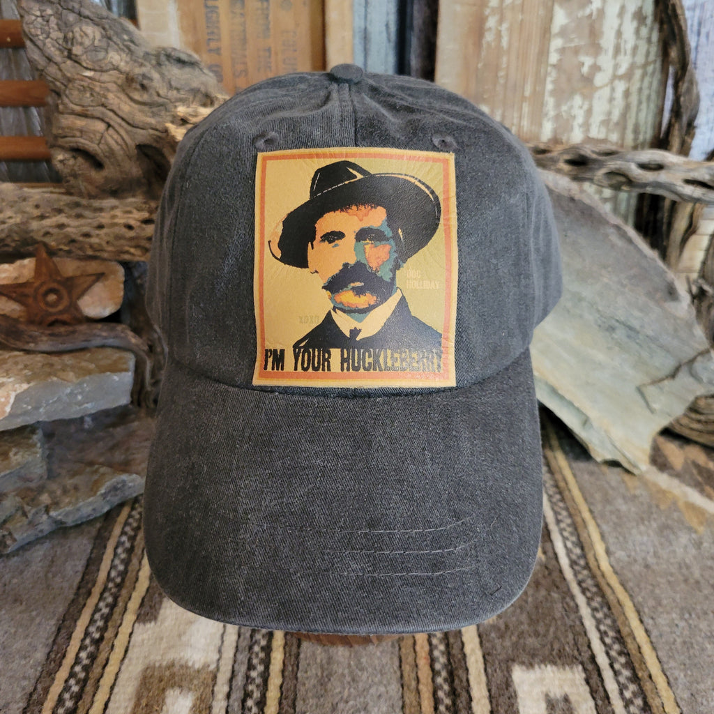 Black distressed baseball cap with a patch of Doc Holliday.