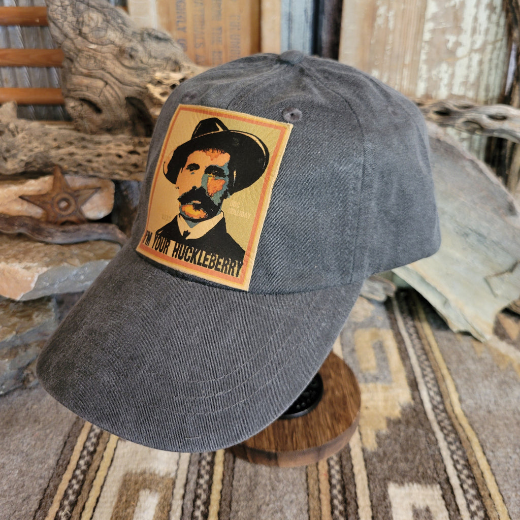 Black distressed baseball cap with a patch of Doc Holliday.