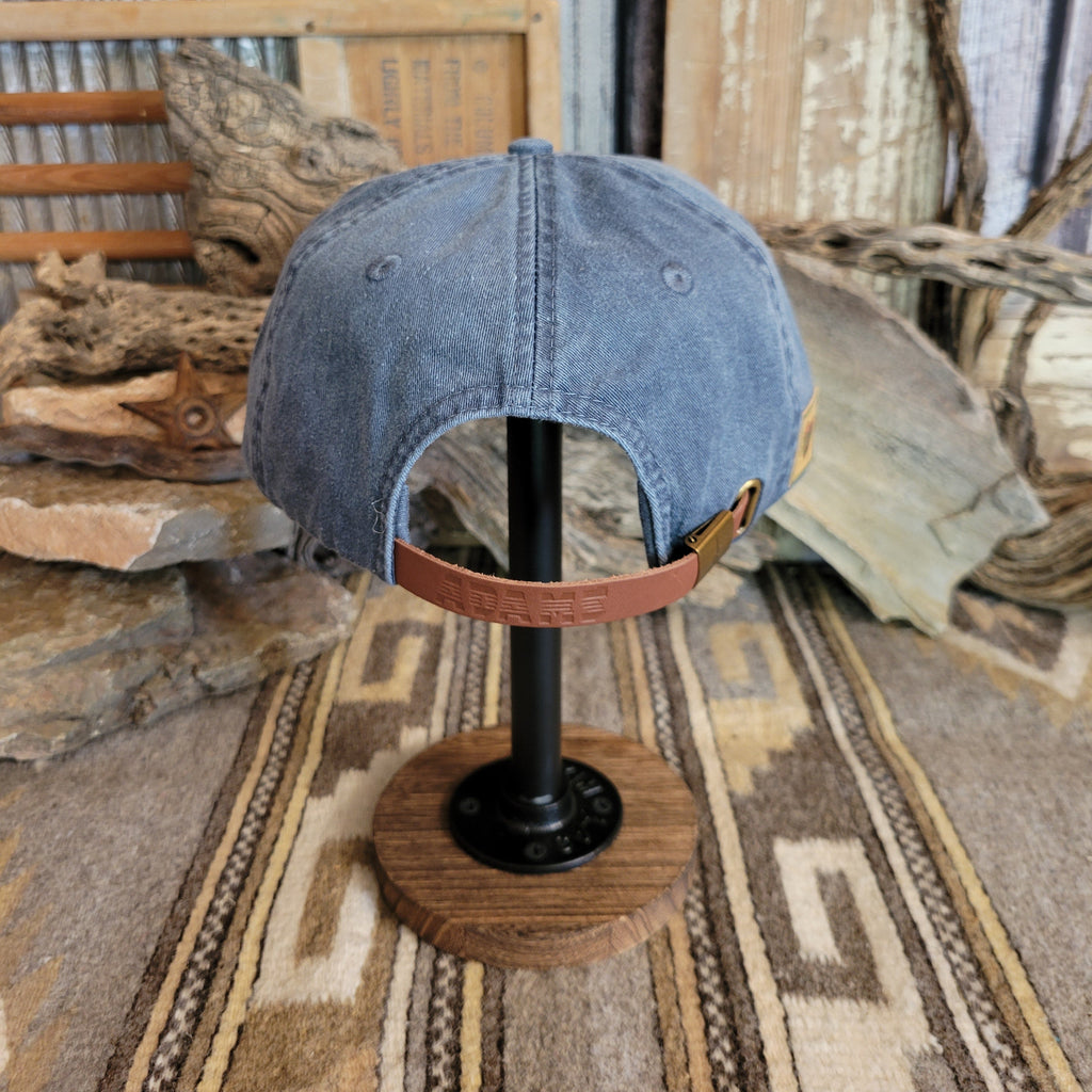 Adjustable snap back closure featured on the back of the cap.