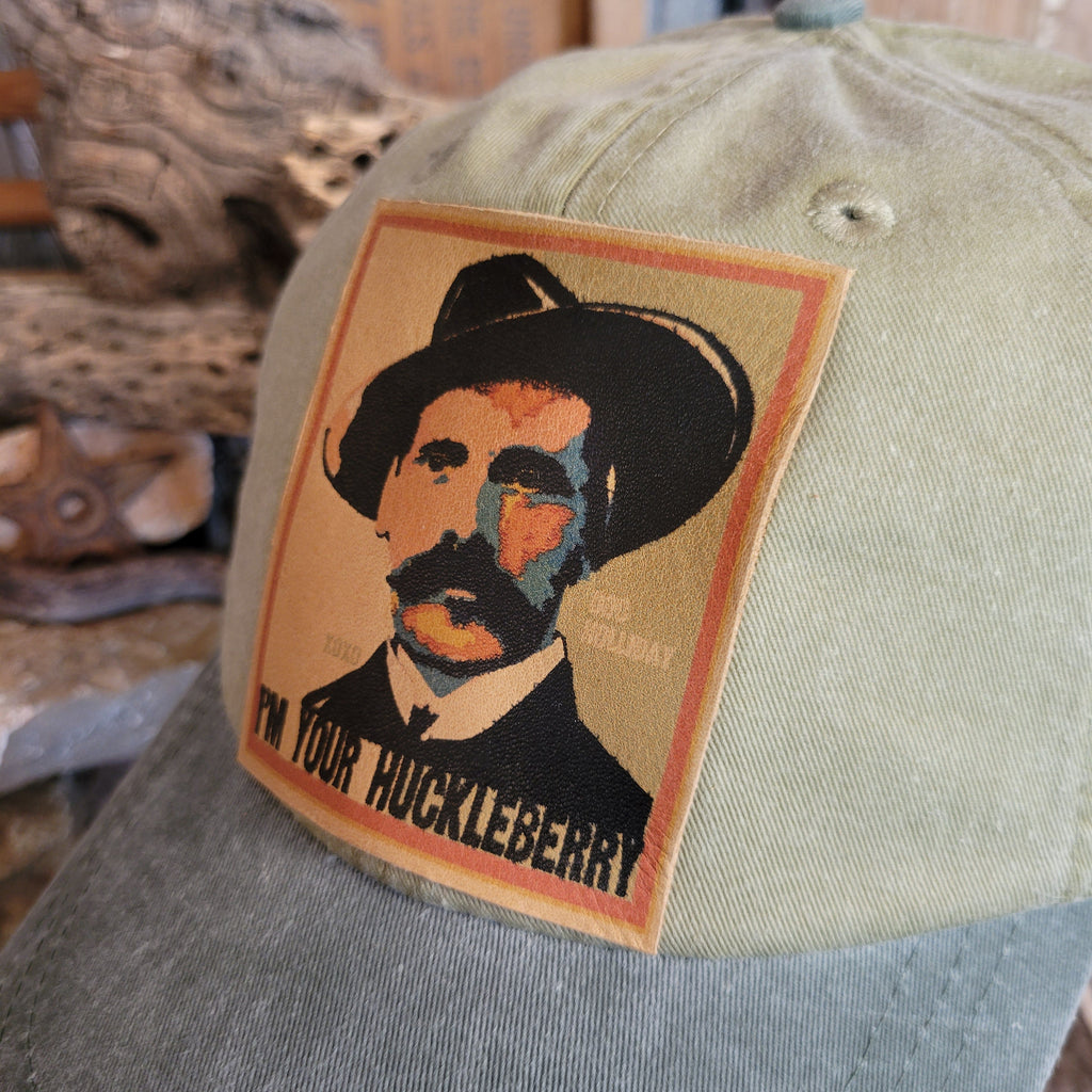 Detailed view of the Doc Holliday patch and slogan on the front of the cap.