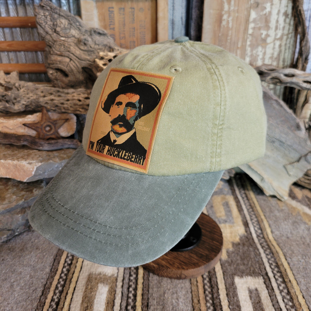 Spruce distressed baseball cap with a patch of Doc Holliday.