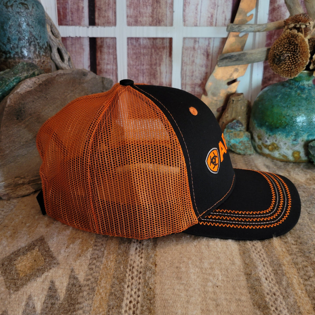 Orange mesh panel with adjustable Velcro strap and curved bill detail.