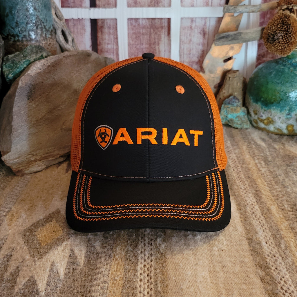 Black and orange trucker cap with orange Ariat logo and embroidered stitching.