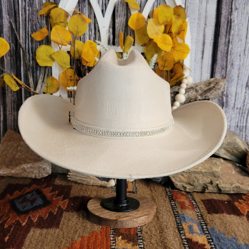 Buckskin felt hat with soft exterior and rhinestone hat band.