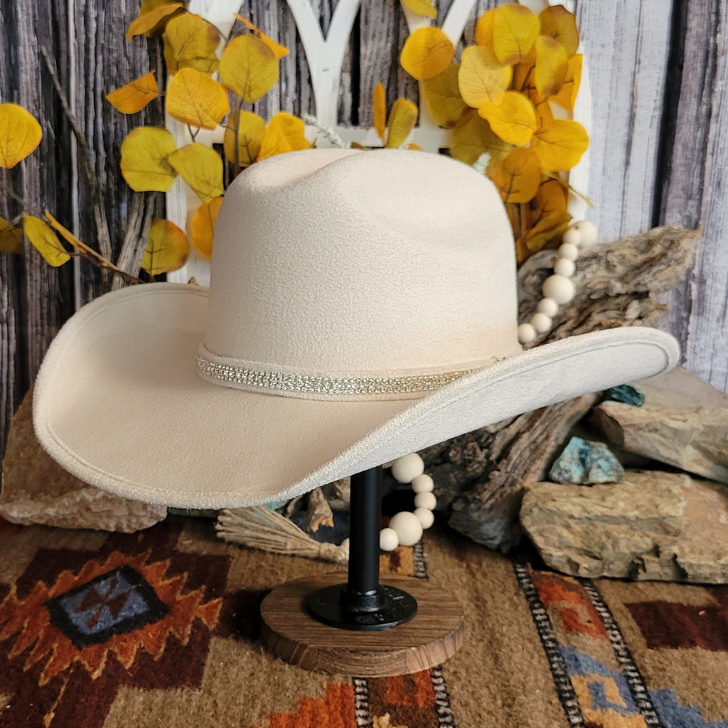 Buckskin felt hat with soft exterior and rhinestone hat band.