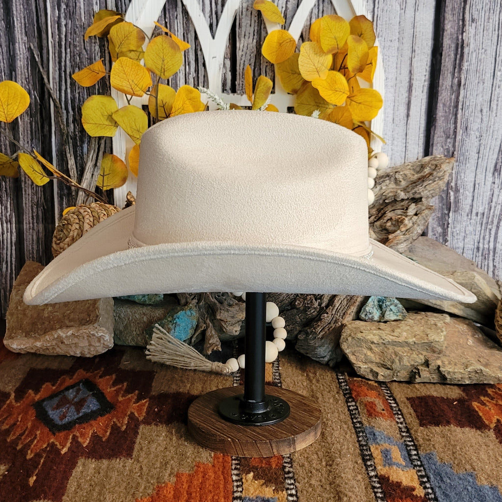 Buckskin felt hat with soft exterior and rhinestone hat band.
