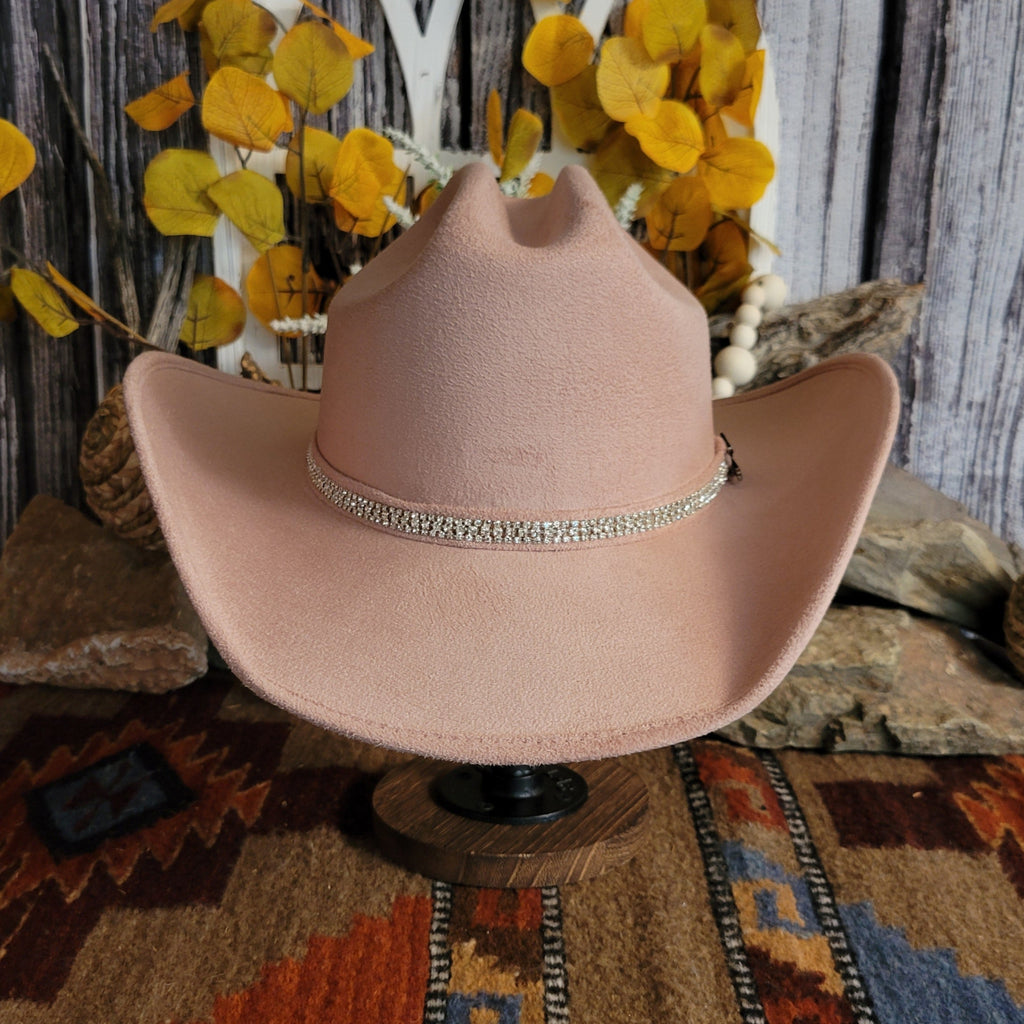 Pink felt hat with soft exterior and rhinestone hat band.