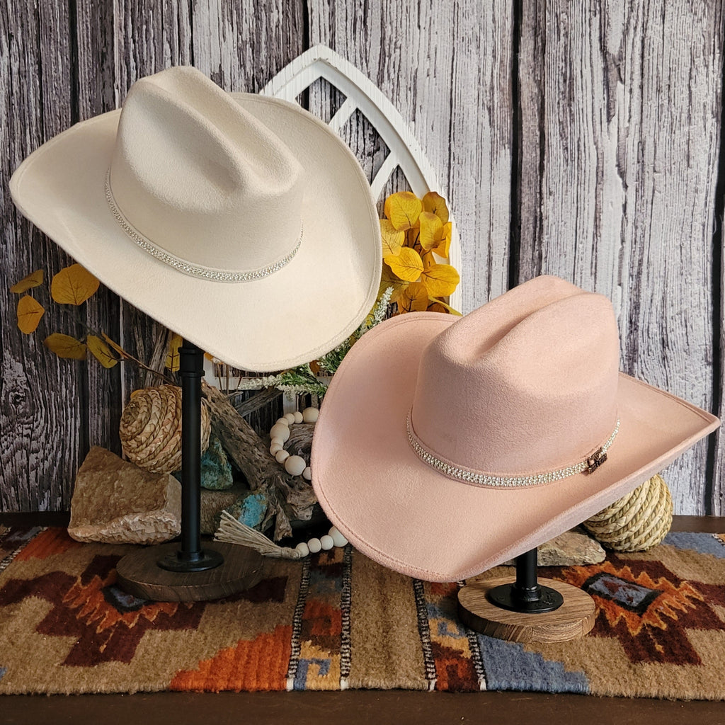 Two felt hats in the colors pink and buckskin, both with rhinestone hat bands.
