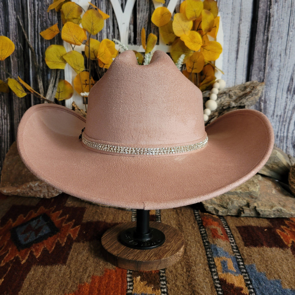Pink felt hat with soft exterior and rhinestone hat band.