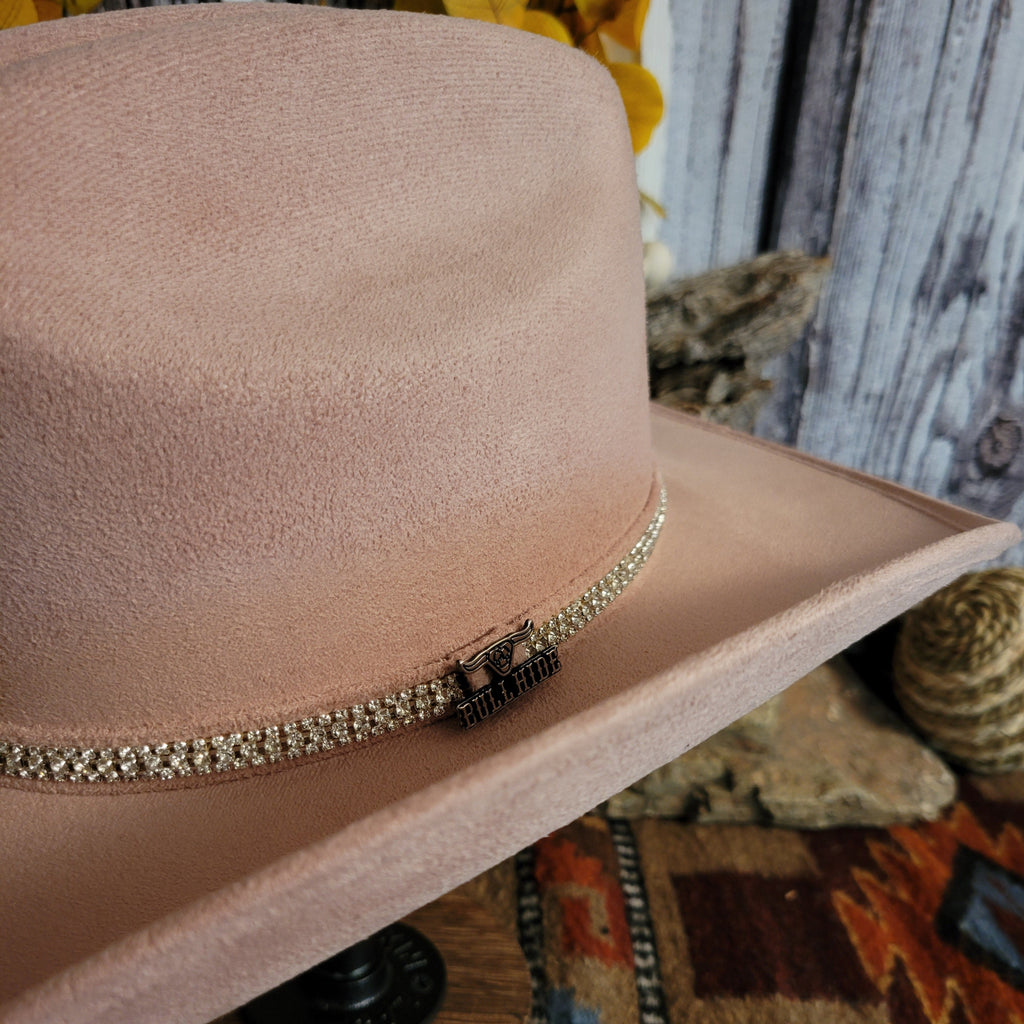 A close-up of the brand's charm found on the rhinestone hat band.