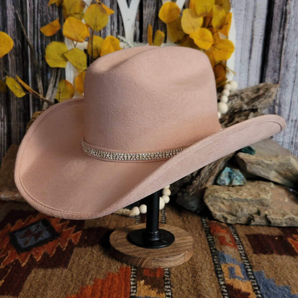 Pink felt hat with soft exterior and rhinestone hat band.