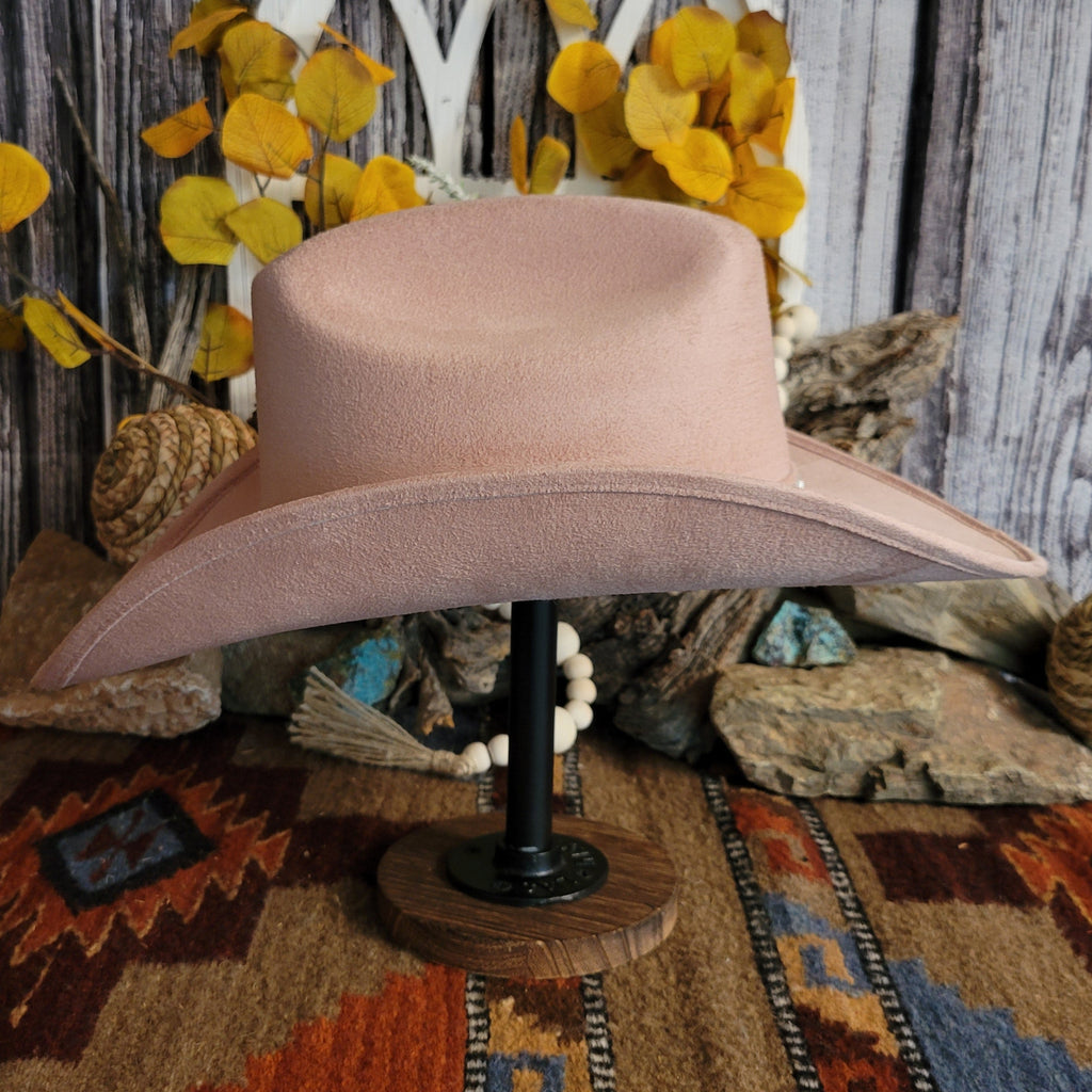 Pink felt hat with soft exterior and rhinestone hat band.
